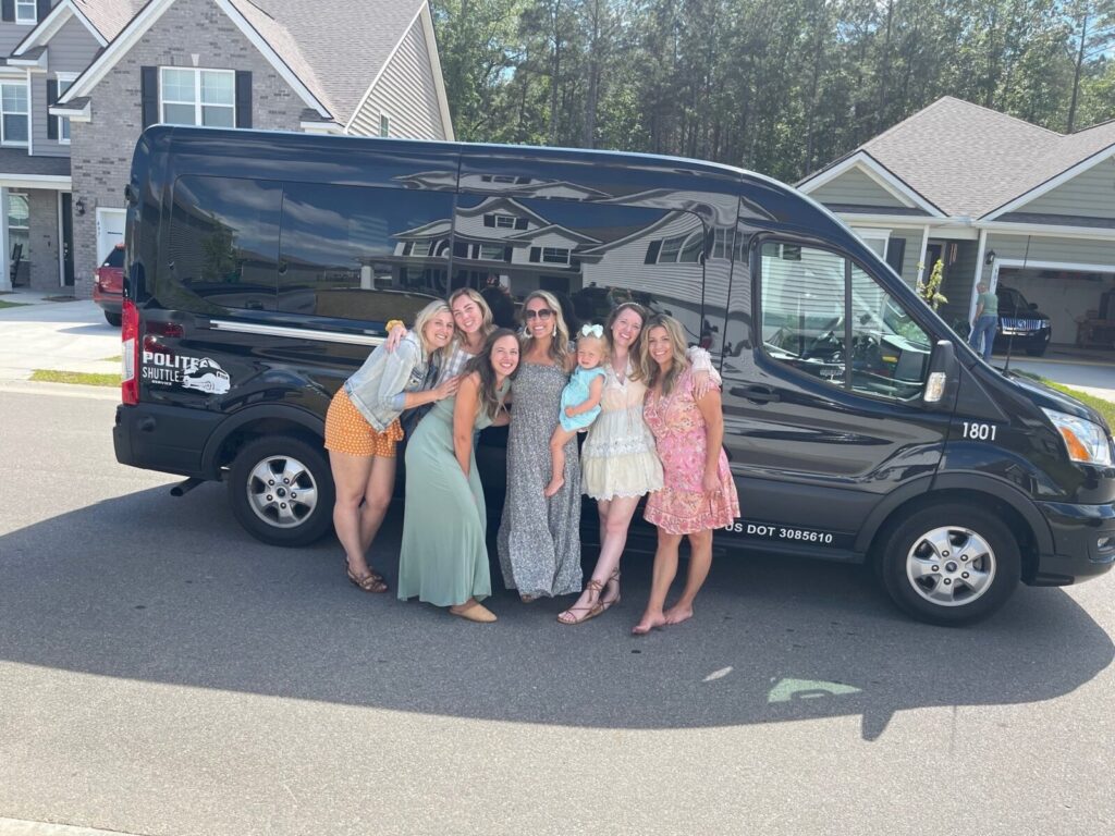 family in front of transportation van